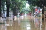 Đường Bế Văn Đàn, phường Thục Phán (Cao Bằng) bị ngập sâu. (Ảnh: Chu Hiệu/TTXVN)