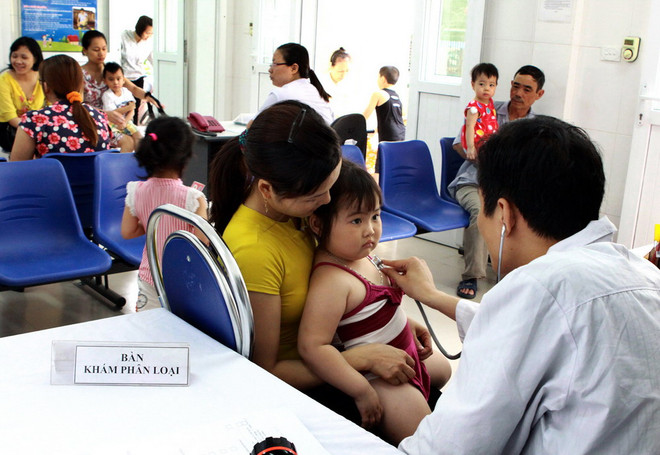 [Photo] Hà Nội: Tiêm phòng sởi miễn phí cho trẻ 2-10 tuổi ảnh 1