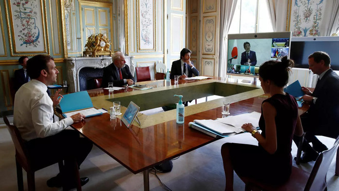 Cuộc họp trực tuyến của nhóm G7. (Ảnh: AFP) Nhóm G7 thống nhất lập trường về WHO và mở cửa trở lại nền kinh tế ảnh 1