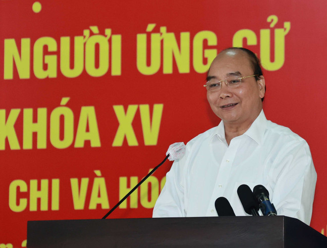 Chủ tịch nước Nguyễn Xuân Phúc phát biểu tại buổi tiếp xúc cử tri huyện Củ Chi ngày 9/5. (Ảnh: Thống Nhất/TTXVN) Chủ tịch nước Nguyễn Xuân Phúc tiếp chức sắc tôn giáo huyện Hóc Môn ảnh 1