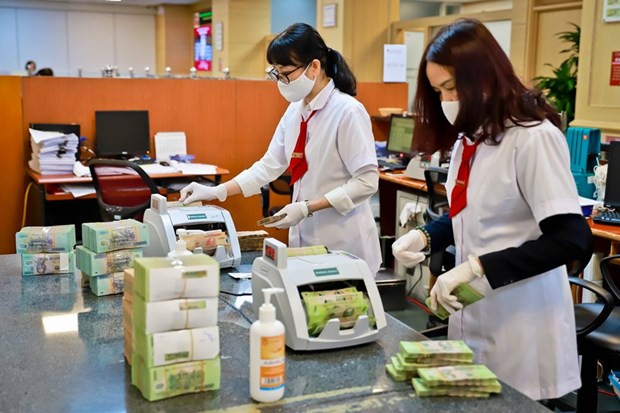 Ảnh minh họa. (Ảnh: CTV/Vietnam+) Cổ phiếu ngân hàng: Động lực tăng trưởng đến từ đầu tư công ảnh 2