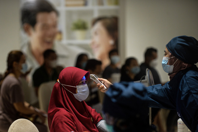 Dịch COVID-19: Indonesia và Malaysia ghi nhận hàng nghìn ca nhiễm mới ảnh 1