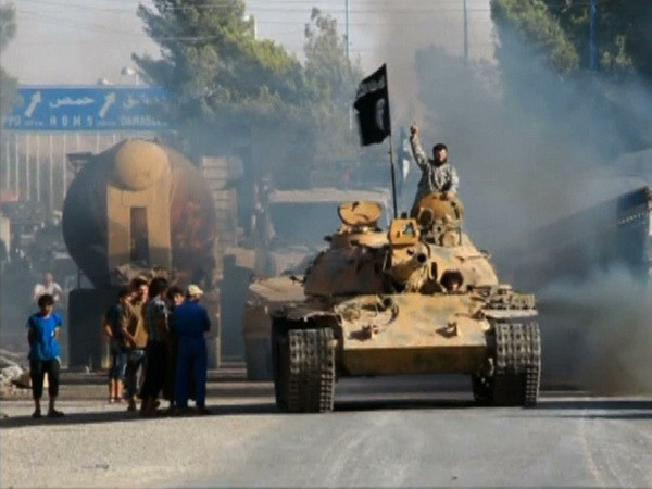 IS tuyên bố sẽ đáp trả các vụ không kích của Mỹ ở Syria ảnh 1