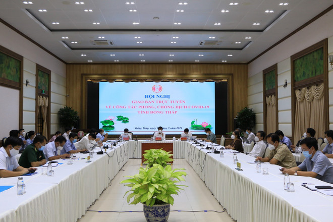 Quang cảnh hội nghị. (Ảnh: Chương Đài/TTXVN) Đồng Tháp yêu cầu “nới lỏng đến đâu, kiểm soát chặt chẽ đến đó" ảnh 2