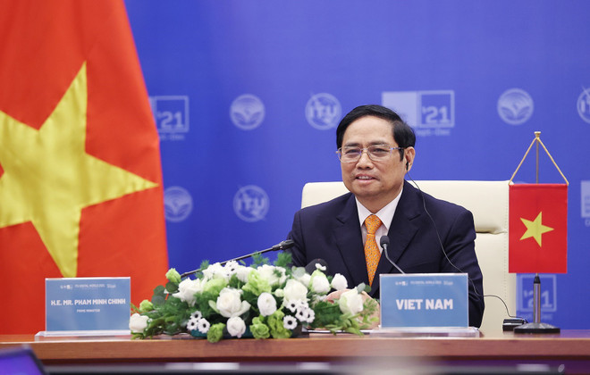 Thủ tướng Phạm Minh Chính phát biểu tại Hội nghị Bộ trưởng ITU Digital World 2021. (Ảnh: Dương Giang/TTXVN) Chuyển đổi số không chỉ là thay đổi công nghệ mà cả tư duy ảnh 2