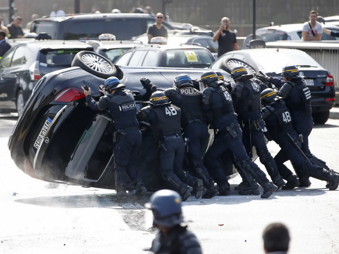 Dịch vụ taxi giá rẻ Uber bị phạt 1,3 triệu USD tại Pháp ảnh 1