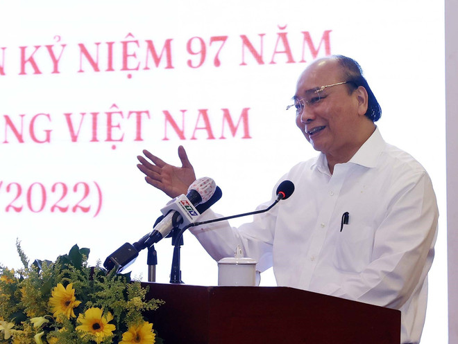 Chủ tịch nước Nguyễn Xuân Phúc phát biểu tại buổi gặp mặt các cơ quan báo chí tại thành phố Hồ Chí Minh. (Ảnh: Thống Nhất/TTXVN) Chủ tịch nước: Báo chí giúp ngăn chặn tham nhũng, tiêu cực từ sớm ảnh 1