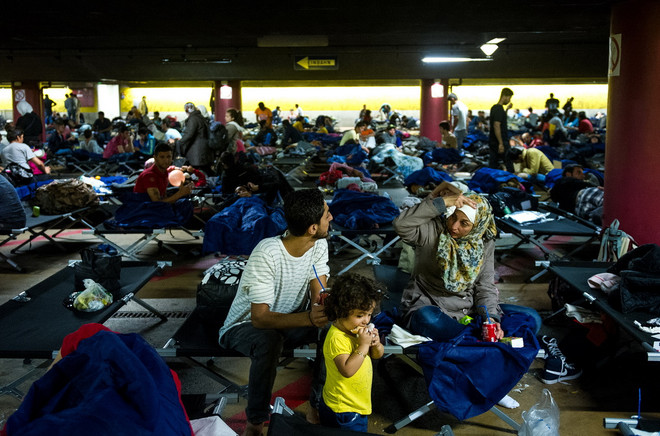 EU nhất trí tái phân bổ 160.000 người tị nạn từ Italy và Hy Lạp ảnh 1