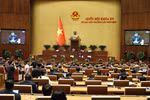 Bộ trưởng Nguyễn Chí Dũng giải trình tại phiên thảo luận, ngày 15/2. (Ảnh: TTXVN)