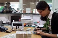 Ngân hàng Nhà nước đề xuất siết điều kiện cho vay ra nước ngoài. (Ảnh: Vietnam+)