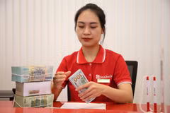 Ngân hàng Nhà nước tăng trần vốn ngắn hạn cho vay dài hạn. (Ảnh: Vietnam+)