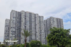 Nhiều người có nhu cầu mua nhà nhưng vẫn chưa thể có cơ hội do nhiều địa phương chưa quan tâm chỉ đạo. (Ảnh: Vietnam+)