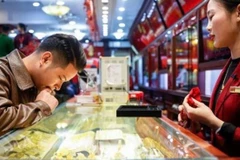 Giá vàng trong nước đi ngang, giao dịch quanh mức 156,4 triệu đồng. (Ảnh: Vietnam+)