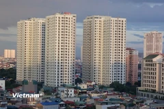 Năm 2026 Ngân hàng Nhà nước sẽ kiểm soát chặt thị trường bất động sản và hướng dòng vốn vào các dự án thực. (Ảnh: Vietnam+)