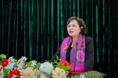 Đồng chí Nguyễn Thị Hồng thay mặt các đồng chí được giới thiệu ứng cử phát biểu tại Hội nghị. (Ảnh: Vietnam+)