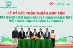 Đại diện 2 đơn vị tại Lễ ký kết thỏa thuận hợp tác. (Ảnh: Vietnam+)