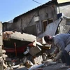 Một ngôi nhà bị sập do động đất ở Đài Nam ngày 21/1. (Ảnh Kyodo News)