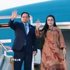 Thủ tướng Phạm Minh Chính và Phu nhân kết thúc chuyến tham dự Hội nghị Thượng đỉnh G20 tại Nam Phi. (Ảnh: Dương Giang/TTXVN)