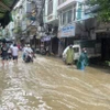 Mưa lớn gây ngập úng trên phố Bạch Đằng, quận Hai Bà Trưng. (Ảnh minh họa: TTXVN)