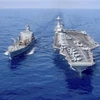 Tàu sân bay USS Gerald R. Ford tiếp nhiên liệu từ tàu tiếp tế dầu USNS Laramie trên đường đến Địa Trung Hải ngày 11/10/2023. (Ảnh: AP)