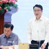 Thứ trưởng Bộ Tài chính Trần Quốc Phương trả lời câu hỏi của phóng viên các cơ quan thông tấn, báo chí. (Ảnh: Phạm Kiên/TTXVN)