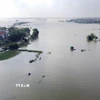 Do ảnh hưởng của cơn bão số 10, mực nước trên sông Lô và sông Phó Đáy dâng cao gây ngập lụt khu vực lớn tại địa bàn xã Sơn Đông tỉnh Phú Thọ. (Ảnh: Hoàng Hùng/TTXVN)