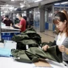 May hàng xuất khẩu sang thị trường EU tại Công ty May TNG (Thái Nguyên). (Ảnh: Trần Việt/TTXVN)