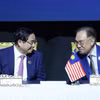 Thủ tướng Phạm Minh Chính và Thủ tướng Malaysia Anwar Ibrahim tại Lễ ký kết Tuyên bố Kuala Lumpur “ASEAN 2045: Tương lai chung của chúng ta". (Ảnh: Dương Giang/TTXVN)