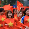 Nữ sinh Học viện Phụ nữ Việt Nam tham gia diễu hành áo dài. (Ảnh: Thành Phương/TTXVN)