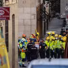 Cảnh sát Quốc gia và nhân viên cứu hộ tại hiện trường tòa nhà bị sập ở Madrid. (Nguồn: Europa Press/Getty Images)