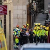 Cảnh sát Quốc gia và nhân viên cứu hộ tại hiện trường tòa nhà bị sập ở Madrid. (Nguồn: Europa Press/Getty Images)