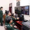 Trung tâm điều hành kỹ thuật công nghệ số phục vụ Đại hội đại biểu Đảng bộ Quân khu 7 áp dụng mô hình "Đại hội không giấy". (Ảnh Xuân Khu/TTXVN)