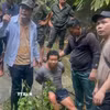 Nghi phạm Hù A San (sinh năm 1991, trú tại thôn Séo Tả 2, xã Hợp Thành, tỉnh Lào Cai) đã bị lực lượng chức năng bắt giữ khi y đang cố thủ trên thác nước trong rừng sâu. (Ảnh: TTXVN phát)