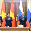 Thủ tướng Phạm Minh Chính và Thủ tướng Liên bang Nga Mikhail Mishustin chứng kiến Lễ ký kết Hiệp định về hợp tác xây dựng Nhà máy điện hạt nhân trên lãnh thổ Việt Nam. (Ảnh: Dương Giang/TTXVN)