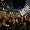 Tuần hành tại Tel Aviv, kêu gọi Chính phủ Israel đạt thỏa thuận với Phong trào Hamas. (Ảnh: THX/TTXVN)