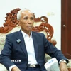 Trưởng ban Tuyên huấn Trung ương Đảng Nhân dân cách mạng Lào Khamphanh Pheuyavong trả lời phỏng vấn. (Ảnh: Xuân Tú/TTXVN)