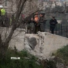 Bức tường bị hư hại do trúng tên lửa tại Jerusalem, ngày 20/3/2026. (Ảnh: THX/TTXVN)