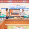 Đồng chí Vũ Việt Trang, Ủy viên Ban Thường vụ Đảng ủy các cơ quan Đảng Trung ương, Phó Trưởng Ban Tuyên giáo và Dân vận Trung ương, Bí thư Đảng ủy, Tổng Giám đốc Thông tấn xã Việt Nam trao ảnh lưu niệm tặng Trưởng Ban Tuyên giáo và Dân vận Trung ương Trịnh Văn Quyết. (Ảnh: Lê Đông/TTXVN)