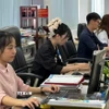 Công chức Thành phố Hồ Chí Minh thành thạo, chuyên nghiệp khi làm việc trên môi trường số. (Ảnh: Hữu Duyên/TTXVN)