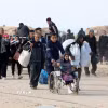 Người dân sơ tán tránh xung đột trở về nhà ở miền Trung Dải Gaza khi lệnh ngừng bắn giữa Israel và phong trào Hamas có hiệu lực, ngày 28/1/2025. (Ảnh: THX/TTXVN)