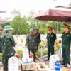 Nghi thức truy điệu, an táng 18 hài cốt liệt sỹ tại Nghĩa trang Liệt sỹ Đức Cơ, tỉnh Gia Lai. (Ảnh: Hoài Nam/TTXVN)
