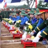 Nghi lễ an táng 76 hài cốt liệt sỹ quân tình nguyện và chuyên gia Việt Nam hi sinh tại Lào. (Ảnh minh họa: Văn Tý/TTXVN)