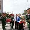 Nghi lễ an táng 76 hài cốt liệt sỹ quân tình nguyện và chuyên gia Việt Nam hi sinh tại Lào. (Ảnh: Văn Tý/TTXVN