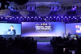 Quang cảnh diễn đàn “Digital Trust in Finance 2026”. (Ảnh: PV/Vietnam+)