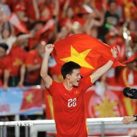 Các cầu thủ U22 Việt Nam hân hoan trong niềm vui chiến thắng. (Ảnh: Minh Quyết/TTXVN)