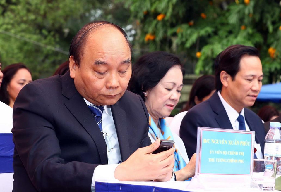 Thủ tướng Nguyễn Xuân Phúc nhắn tin ủng hộ chương trình Đồng hành cùng phụ nữ biên cương tại Lễ phát động. (Ảnh: Thống Nhất/TTXVN)