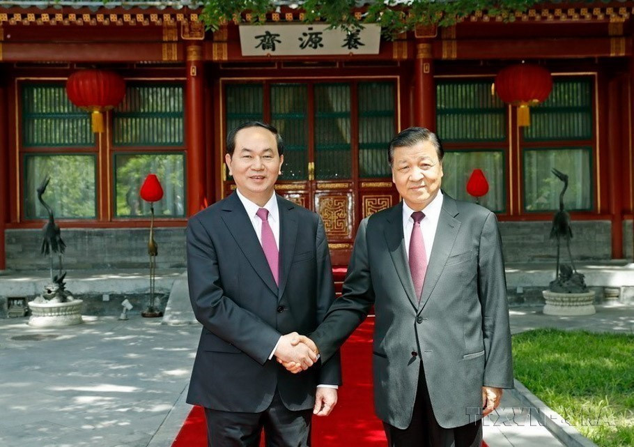 Chủ tịch nước Trần Đại Quang gặp Ủy viên Thường vụ Bộ Chính trị, Bí thư Ban Bí thư Trung ương Đảng Cộng sản Trung Quốc Lưu Vân Sơn, trong chuyến thăm cấp Nhà nước tới Trung Quốc (5/2017). (Ảnh: Nhan Sáng/TTXVN)