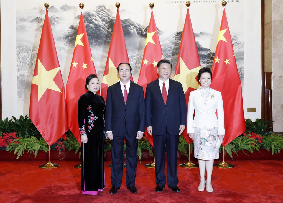 Tổng Bí thư, Chủ tịch nước Trung Quốc Tập Cận Bình và Phu nhân đón Chủ tịch nước Trần Đại Quang và Phu nhân. (Ảnh: Nhan Sáng/TTXVN)