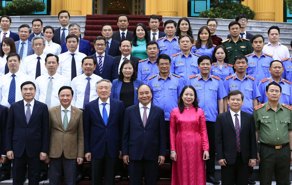 Chủ tịch nước Nguyễn Xuân Phúc với các đại biểu dự Lễ ký Quy chế phối hợp công tác. (Ảnh: Thống Nhất/TTXVN)