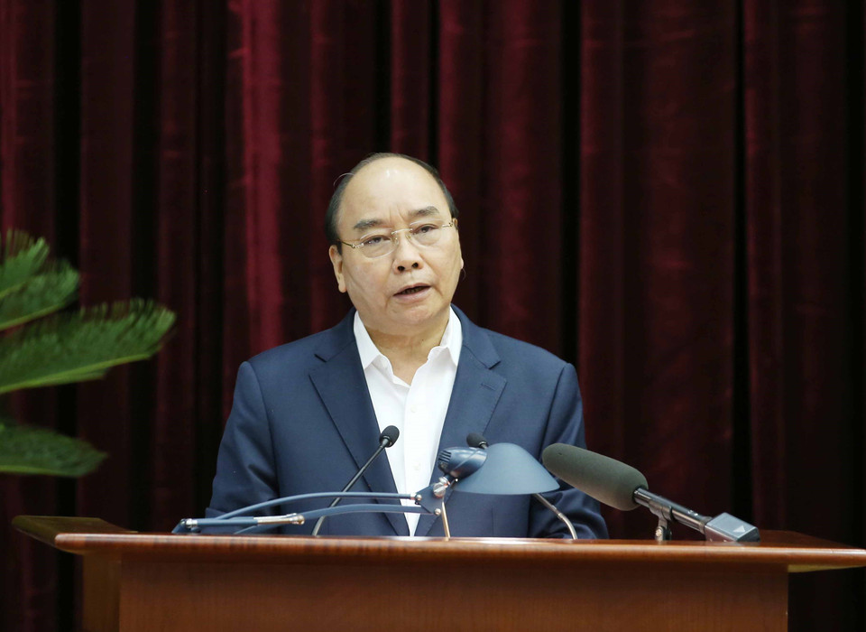 Ủy viên Bộ Chính trị, Thủ tướng Chính phủ Nguyễn Xuân Phúc trình bày báo cáo tại hội nghị. (Ảnh: Phương Hoa/TTXVN)